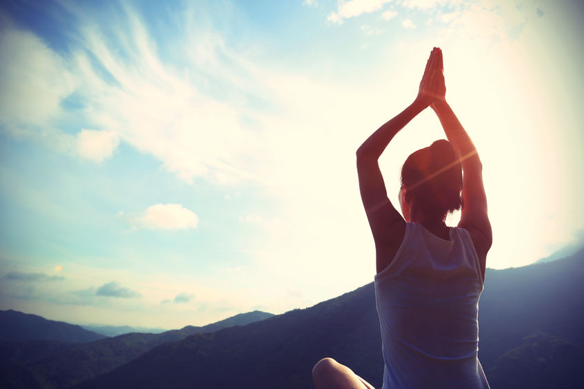 49956398 – young yoga woman sit meditation on sunrise mountain peak