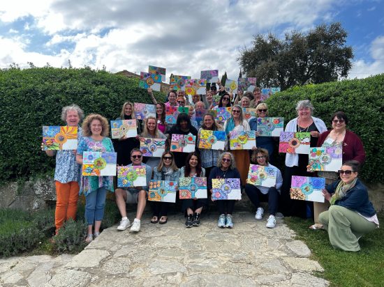 image1 Image of Colette and a group of students displaying the boards they created in Tuscany.