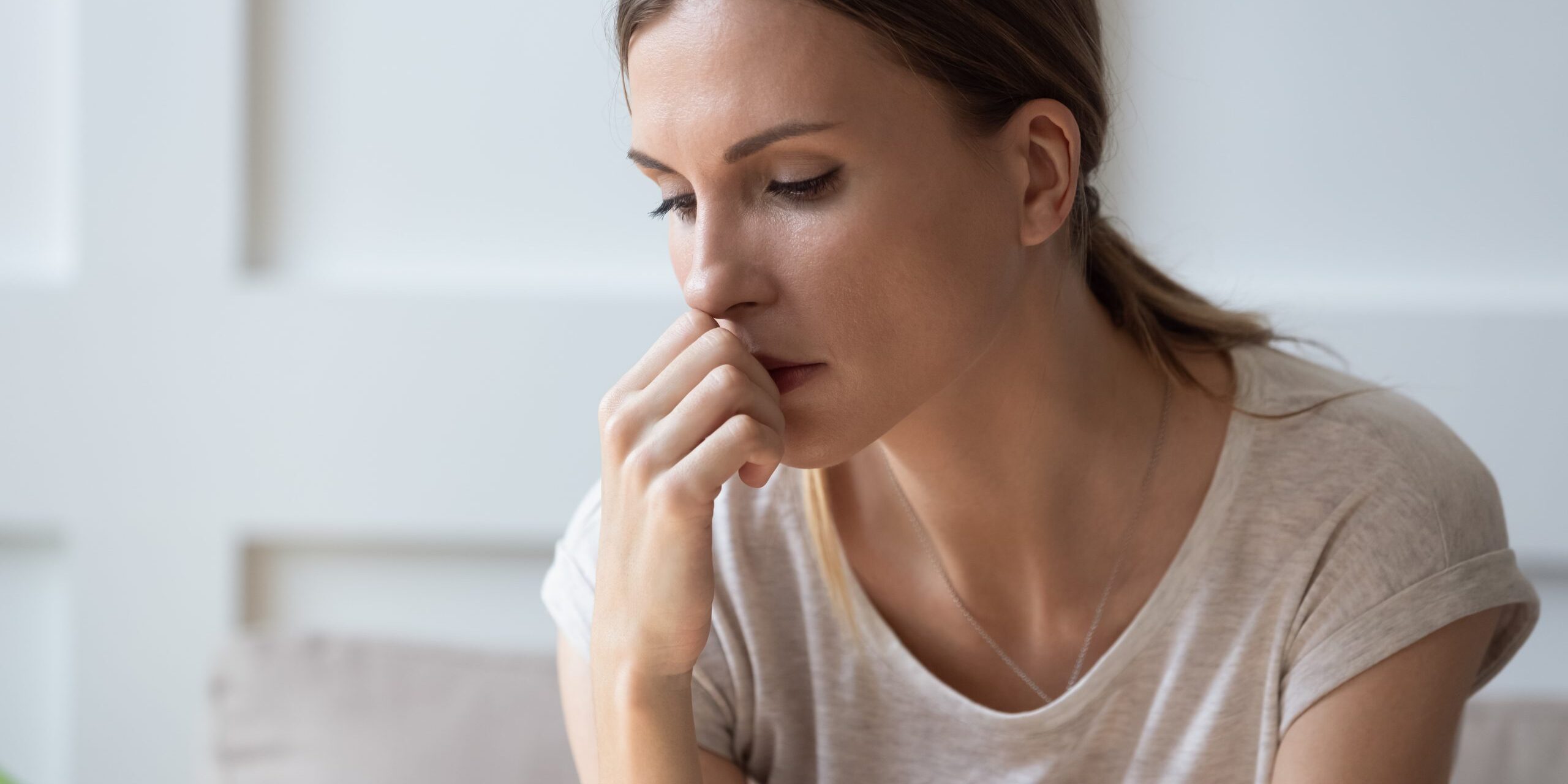 Close,Up,Of,Sad,Pensive,Millennial,Woman,Sit,Alone,Thinking