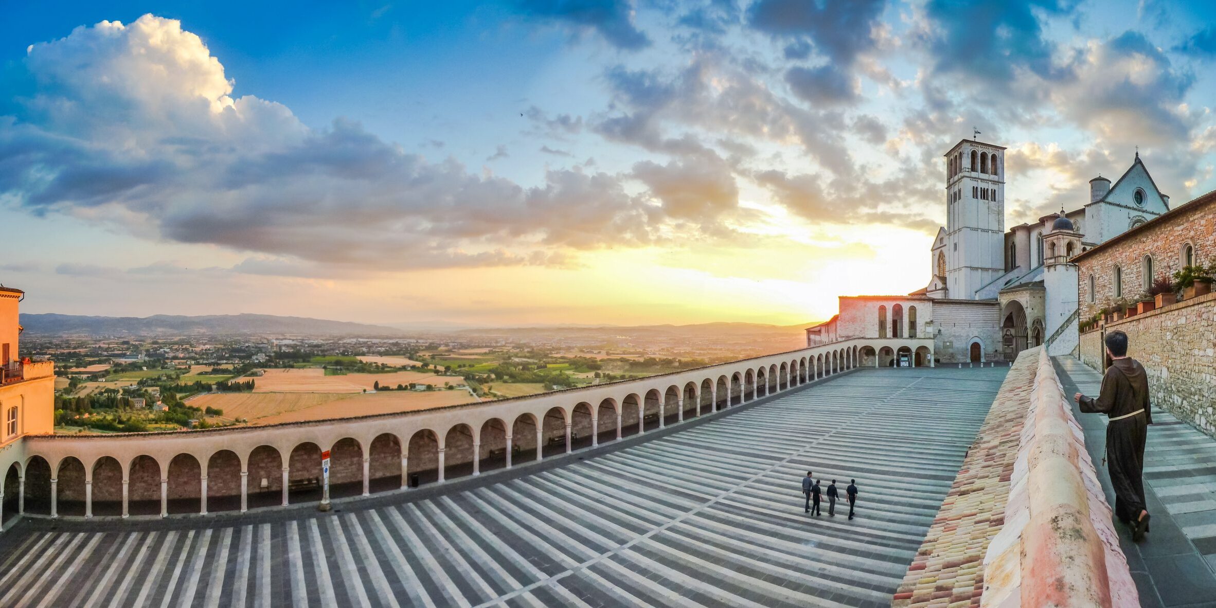 Monk,Walking,Towards,Famous,Basilica,Of,St.,Francis,Of,Assisi